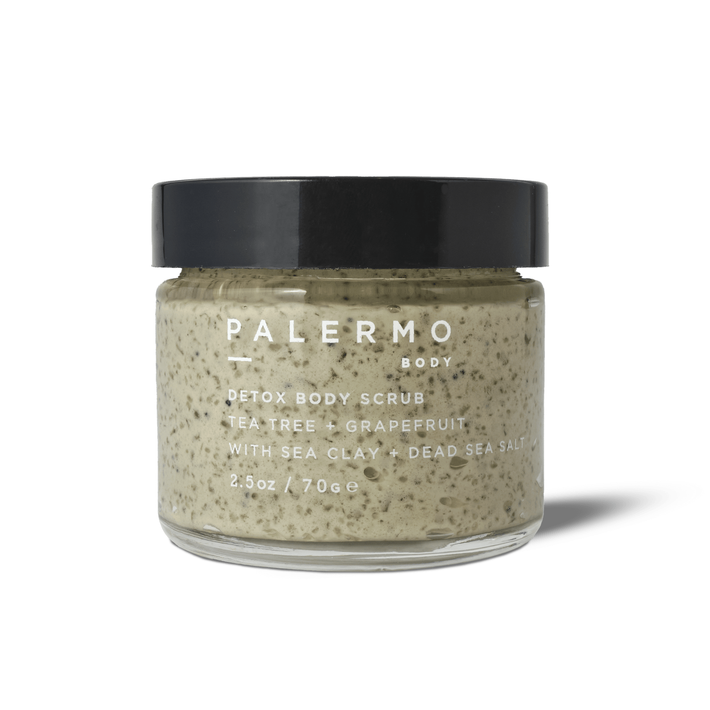 Palermo Body Detox Body Scrub comes in a clear glass jar with a black lid, containing 2.5 oz (70 g) of sea clay and Dead Sea salt formula with tea tree and grapefruit.
