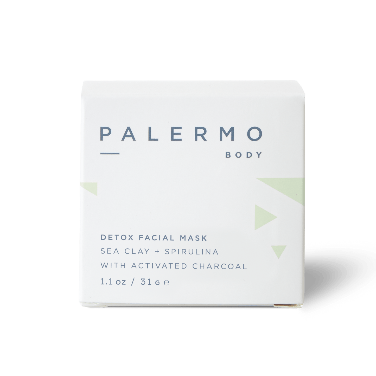 A white box labeled "Palermo Body" holds the Detox Facial Mask with French sea clay, spirulina, and activated charcoal. The box reads "1.1 oz / 31 g" and is accented with minimal green geometric designs.