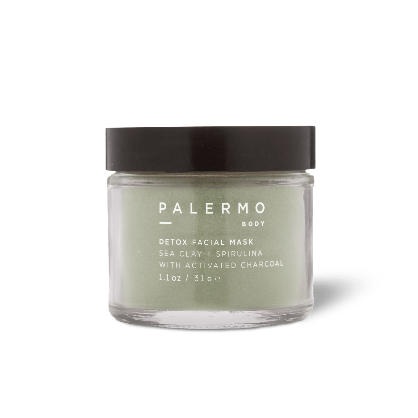 The Palermo Body Detox Facial Mask is a clarifying powder in a clear glass jar with a black lid, featuring French sea clay, spirulina, and activated charcoal. Size: 1.1 oz (31g).