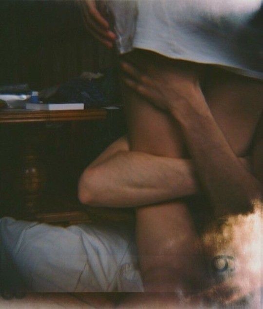 A partially obscured, intimate embrace is bathed in soft light and dreamy blur—evoking the subtle allure of River Organics’ Flore: Jasmine + Neroli Botanical Scent Balms drifting gently through the air.