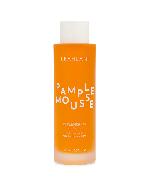 A 150 ml (5 fl oz) bottle of LEAHLANI Pamplemousse Replenishing Body Oil, featuring orange liquid, white text, a white cap, and infused with moisturizing tropical oils plus Vitamin C.