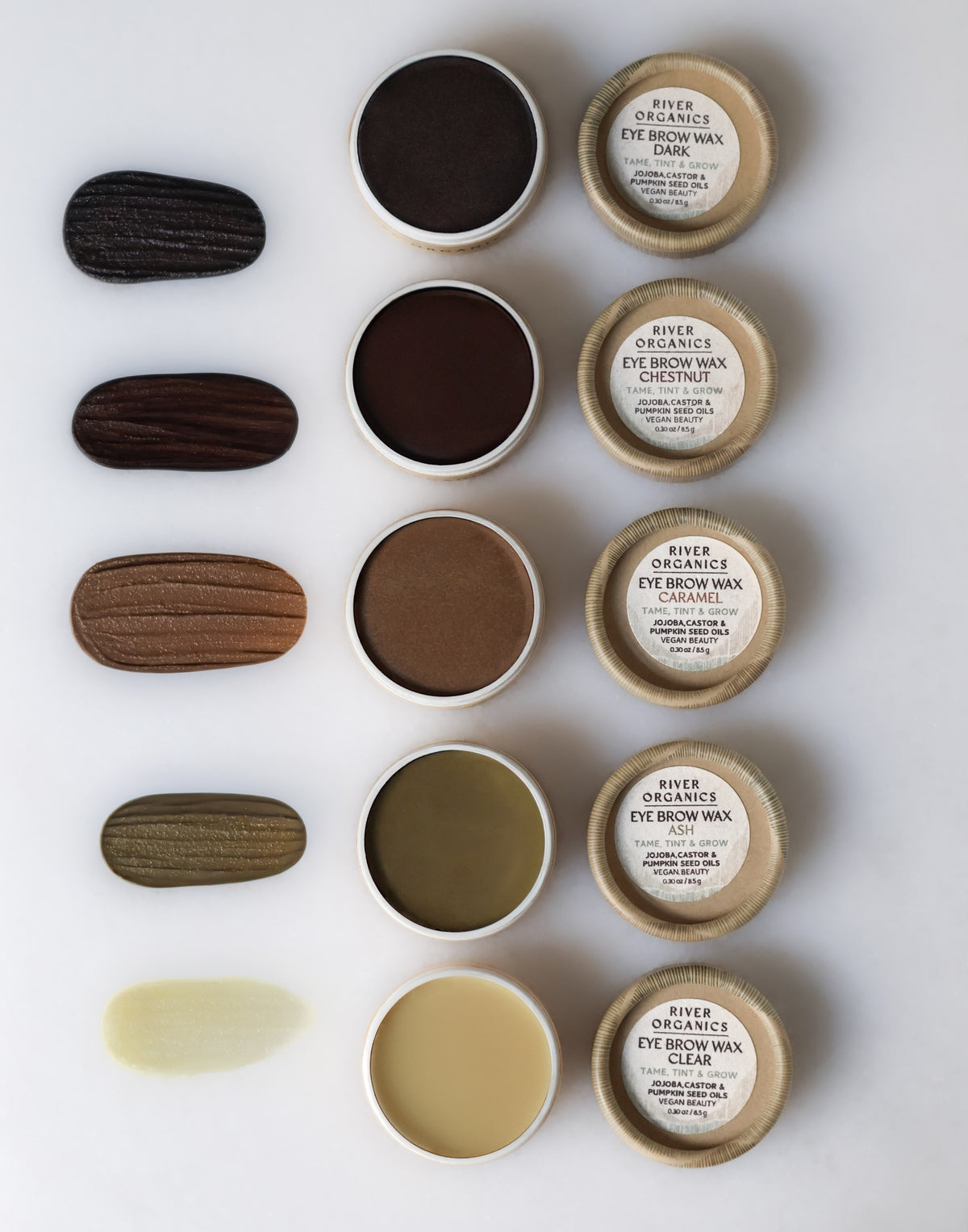 Five open containers from the River Organics Brow Wax + Blush + Lip Balm Bundle, each labeled Dark Brown, Chestnut, Auburn, Blonde, and Clear—ideal to pair with your favorite brow growth serum for fuller-looking brows.