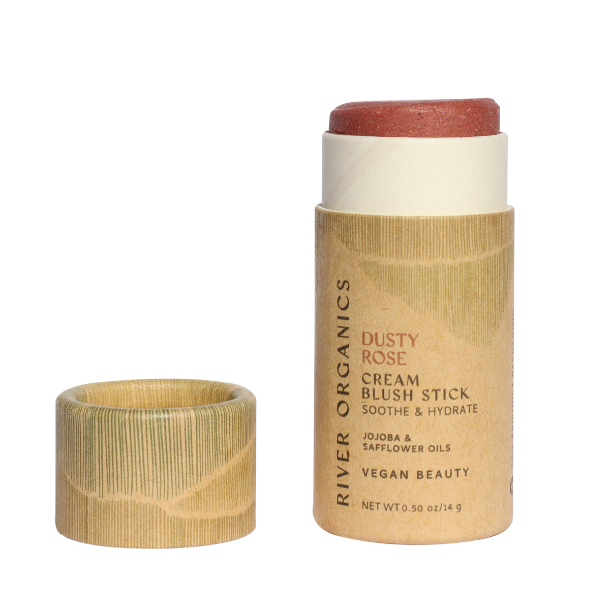 A tube of River Organics Natural Cream Blush Stick in Dusty Rose with the cap off, revealing the blush. The eco-friendly, plastic-free tan packaging features gold accents and printed product details on the label.