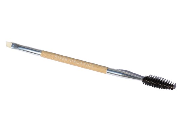 The Eco-Friendly Double-Sided Bare Wood Brow & Mascara Brush by River Organics features a spoolie and angled brush. Its sleek wooden handle with metal accents is perfect for your favorite brow wax, offering flawless definition.