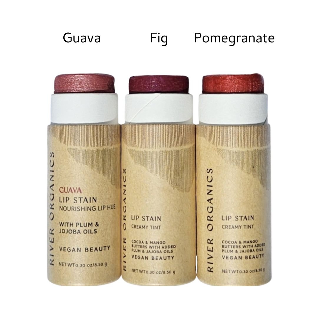 River Organics Lip Stain Sets include Guava, Fig, and Pomegranate for pink or red shades. Each non-toxic lip stain features beige packaging with black text.