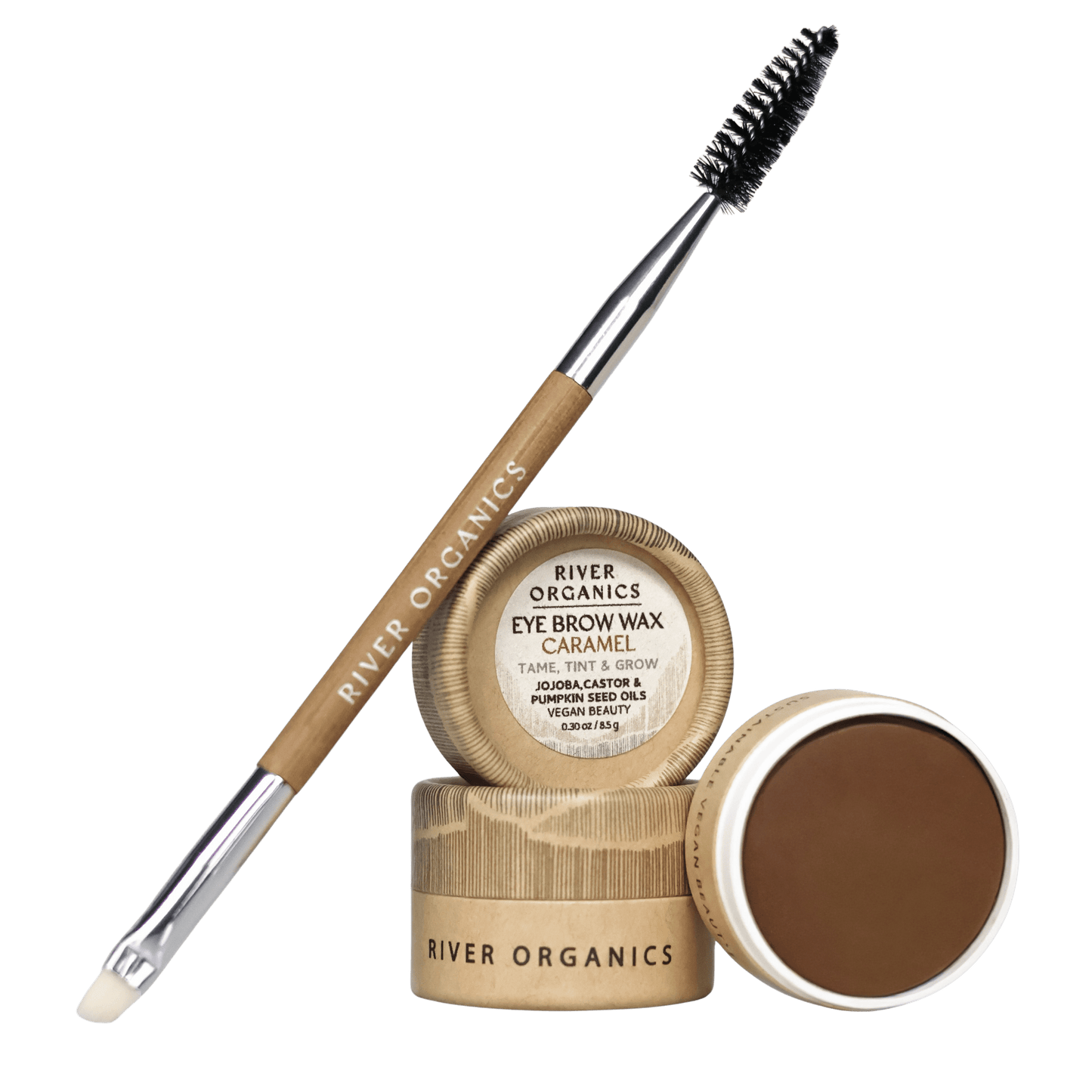 Two eyebrow grooming essentials are featured: River Organics' dual-ended brow brush and the open Brow Wax - Tame, Tint & Grow, a vegan caramel-toned formula for sustainable styling and shaping.