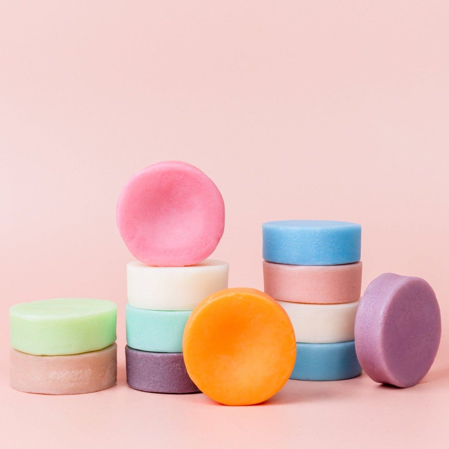 A collection of vibrant Conditioner Bars from ZeroWasteStore.com, each round and colorful, ideal for a sustainable zero waste hair care routine.