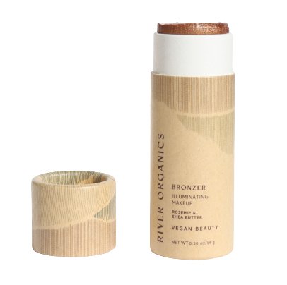 This vegan, cruelty-free bronzer stick comes in light brown cardboard packaging with "River Organics," "Bronzer," and "Illuminating Makeup" text. Enriched with rosehip and shea butter, it offers premium bronzers at 0.5 oz/15g. Part of the Imperfect Highlighters & Bronzers collection.