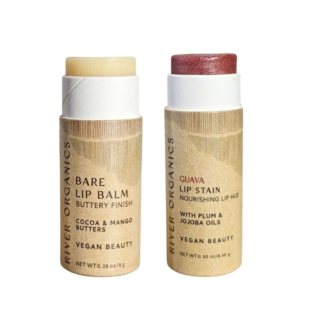 River Organics Set of 2: one beige Bare vegan lip balm and one reddish Guava hydrating lip stain. Both are vegan beauty products made with natural ingredients in cardboard tubes.