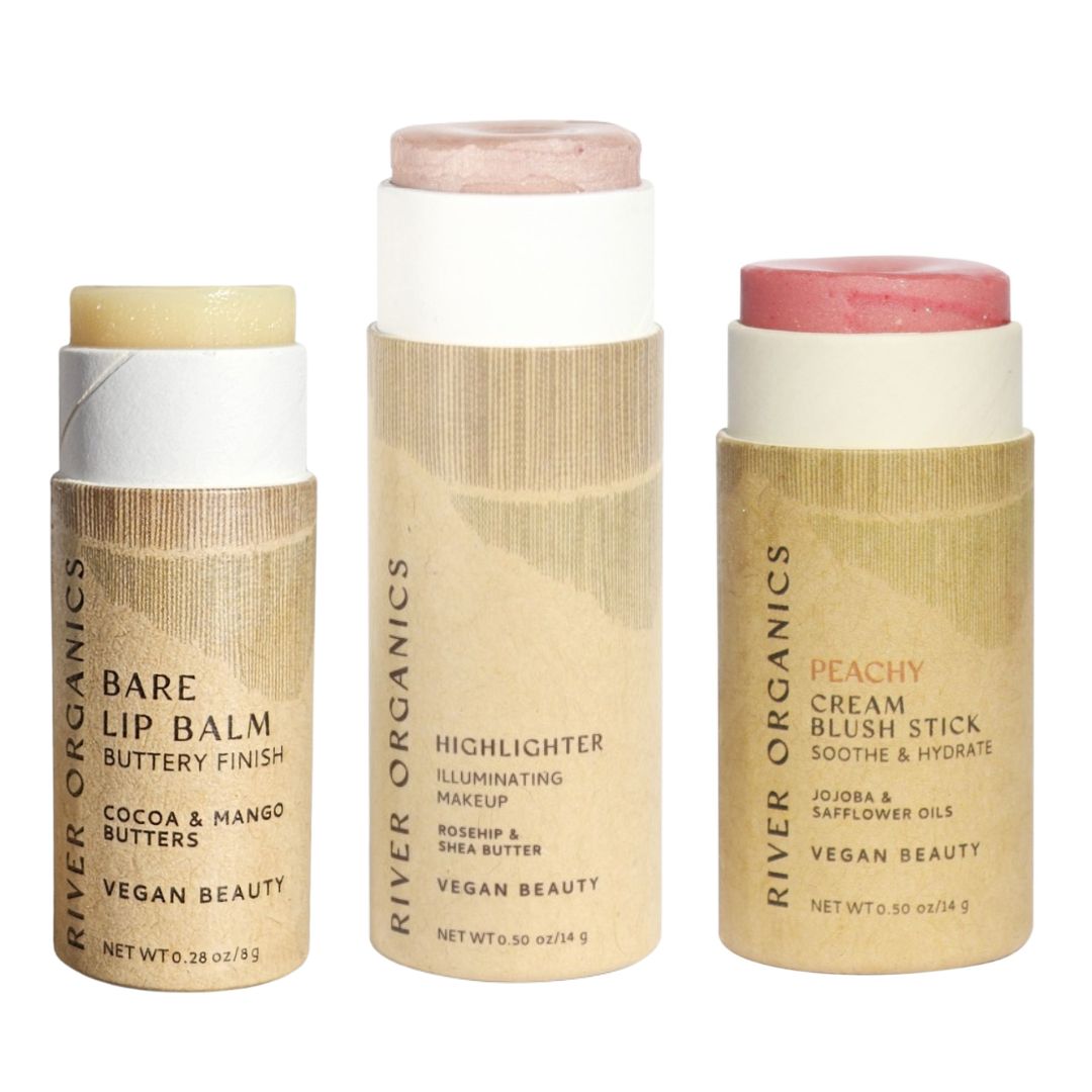 River Organics’ Lip + Highlighter + Blush Set features visible shades in plastic-free packaging—ideal for a customizable, clean beauty makeup set.