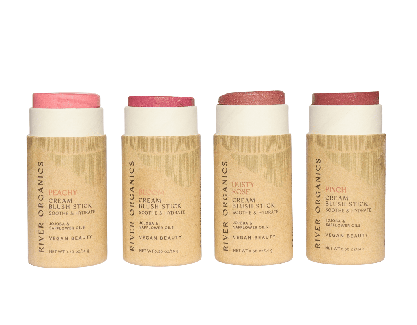 River Organics’ Natural Cream Blush Stick (All Colors) comes in cardboard, plastic-free tubes with visible tops. Available in Peachy, Bloom, Dusty Rose, and Pinch—zero-waste shades ranging from pink to peach.