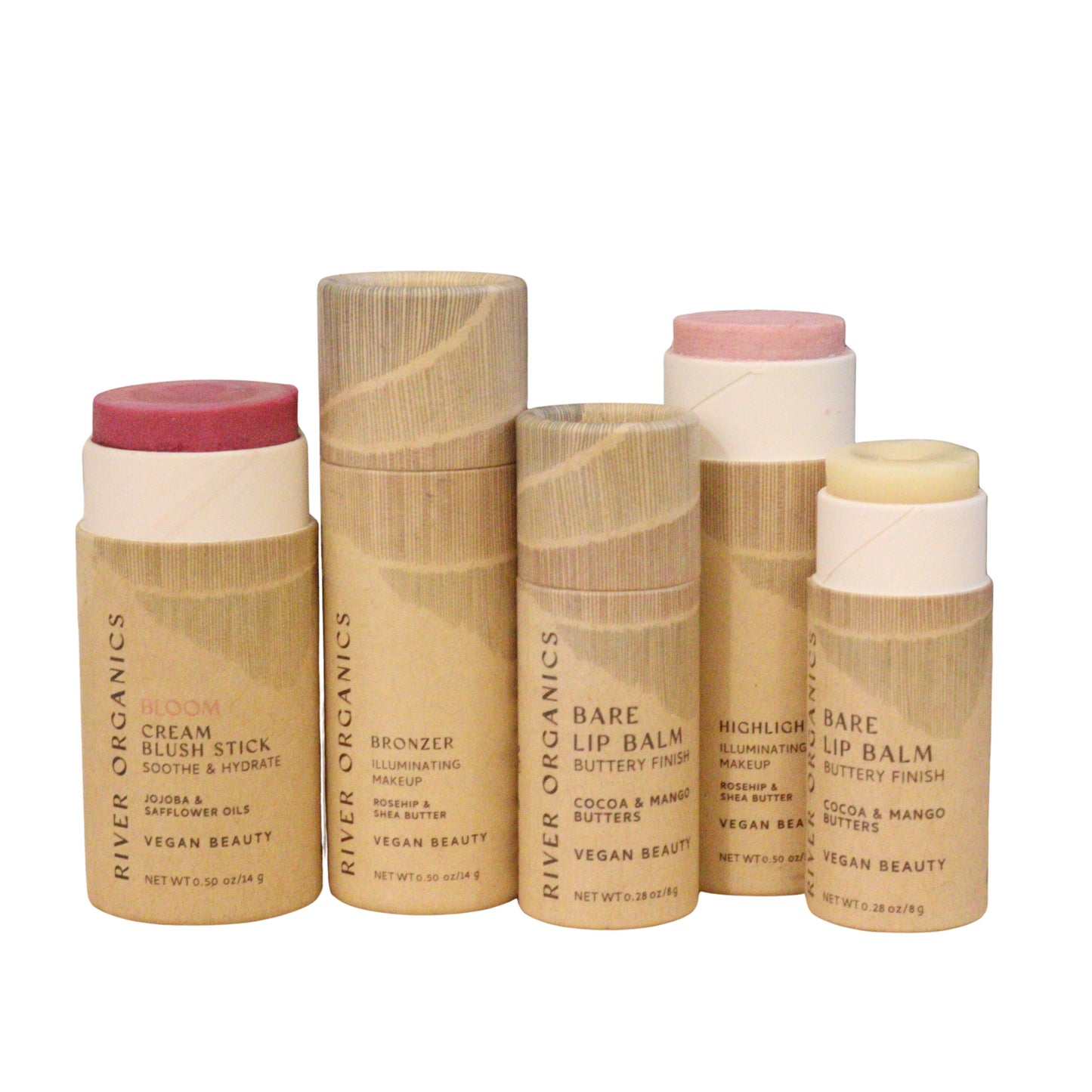 Five cylindrical River Organics Colour Sets include vegan blush, bronzer, zero-waste highlighter, and two lip balms—all in eco-friendly natural packaging with clear product labels.