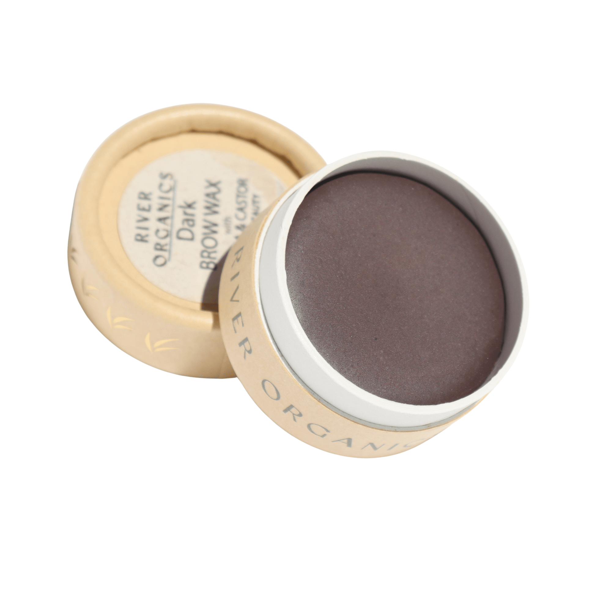 A small, round container with a lid labeled "River Organics Dark Vegan Shaping Eyebrow Wax" holds a dark brown vegan brow wax. Encased in beige cardboard, it embodies sustainable beauty with its minimalist design.