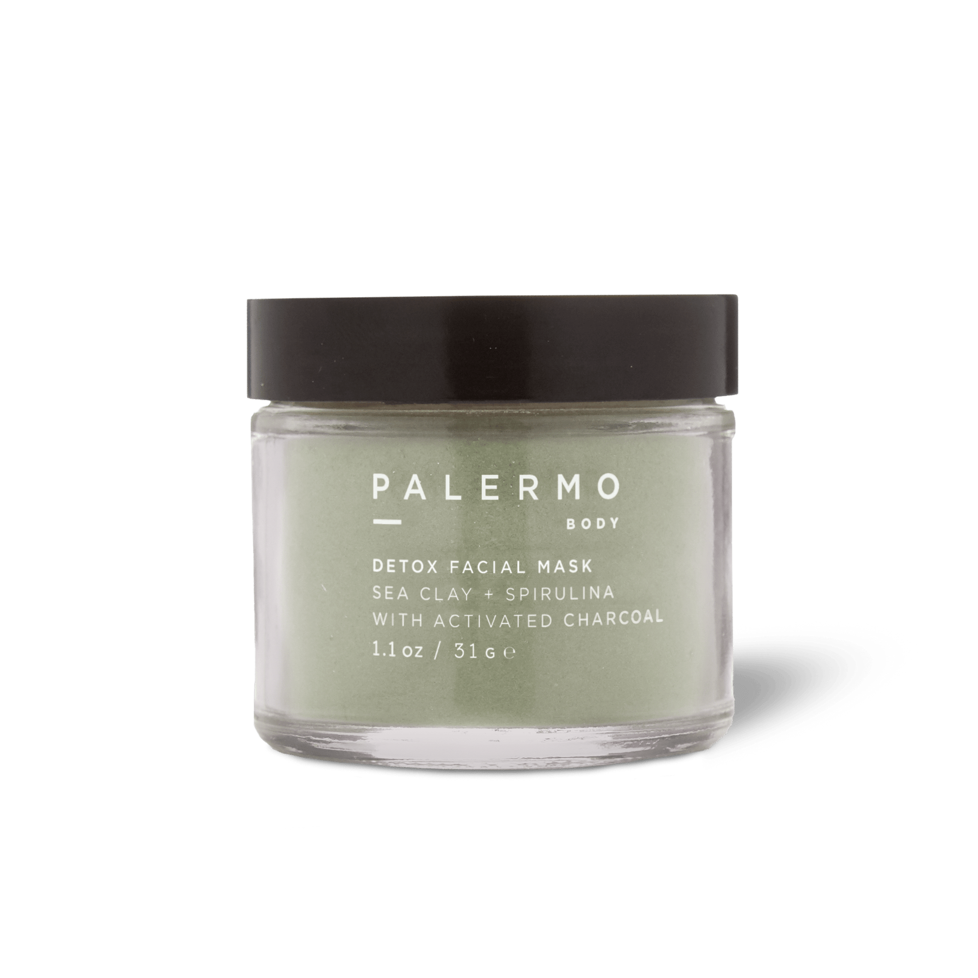 The Palermo Body Detox Facial Mask is a clarifying powder in a clear glass jar with a black lid, featuring French sea clay, spirulina, and activated charcoal. Size: 1.1 oz (31g).