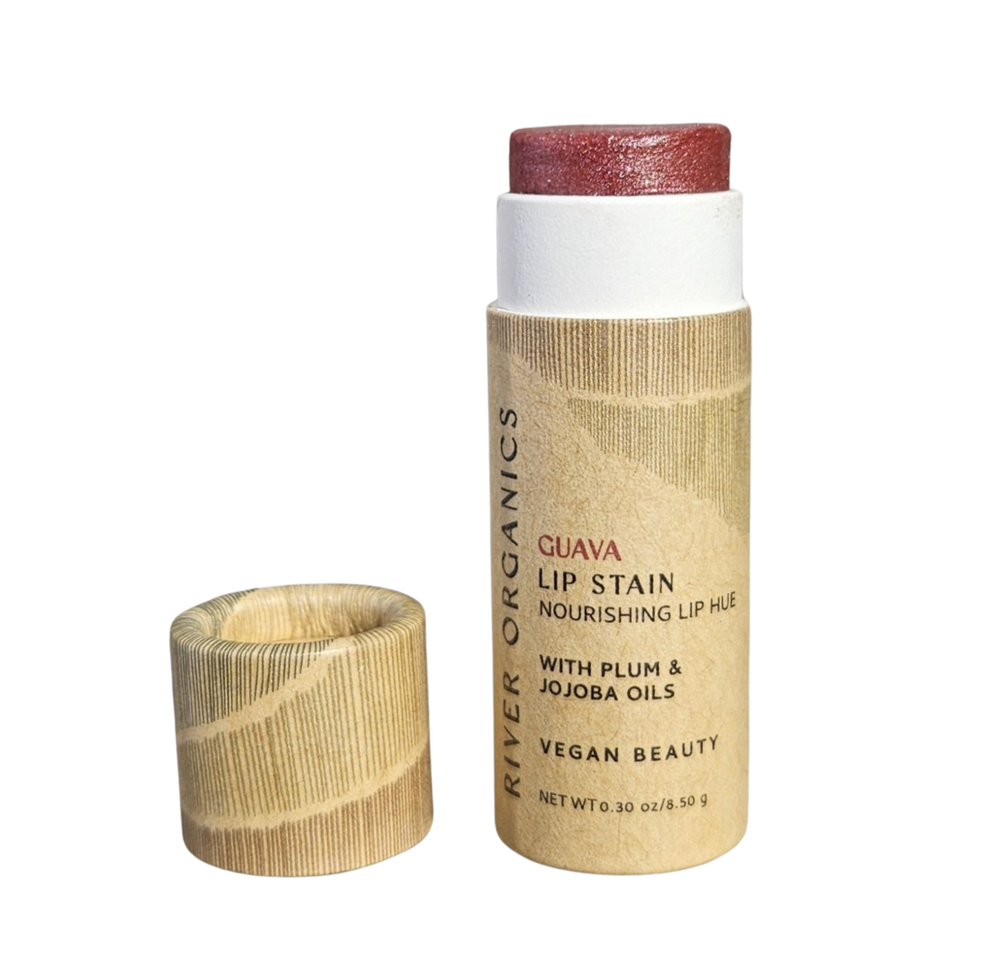 A tube of River Organics Lip + Concealer Set with the cap off, showing the pinkish product inside. The label highlights nourishing ingredients like plum and jojoba oils, and notes that it is vegan—a perfect addition to any clean beauty routine.