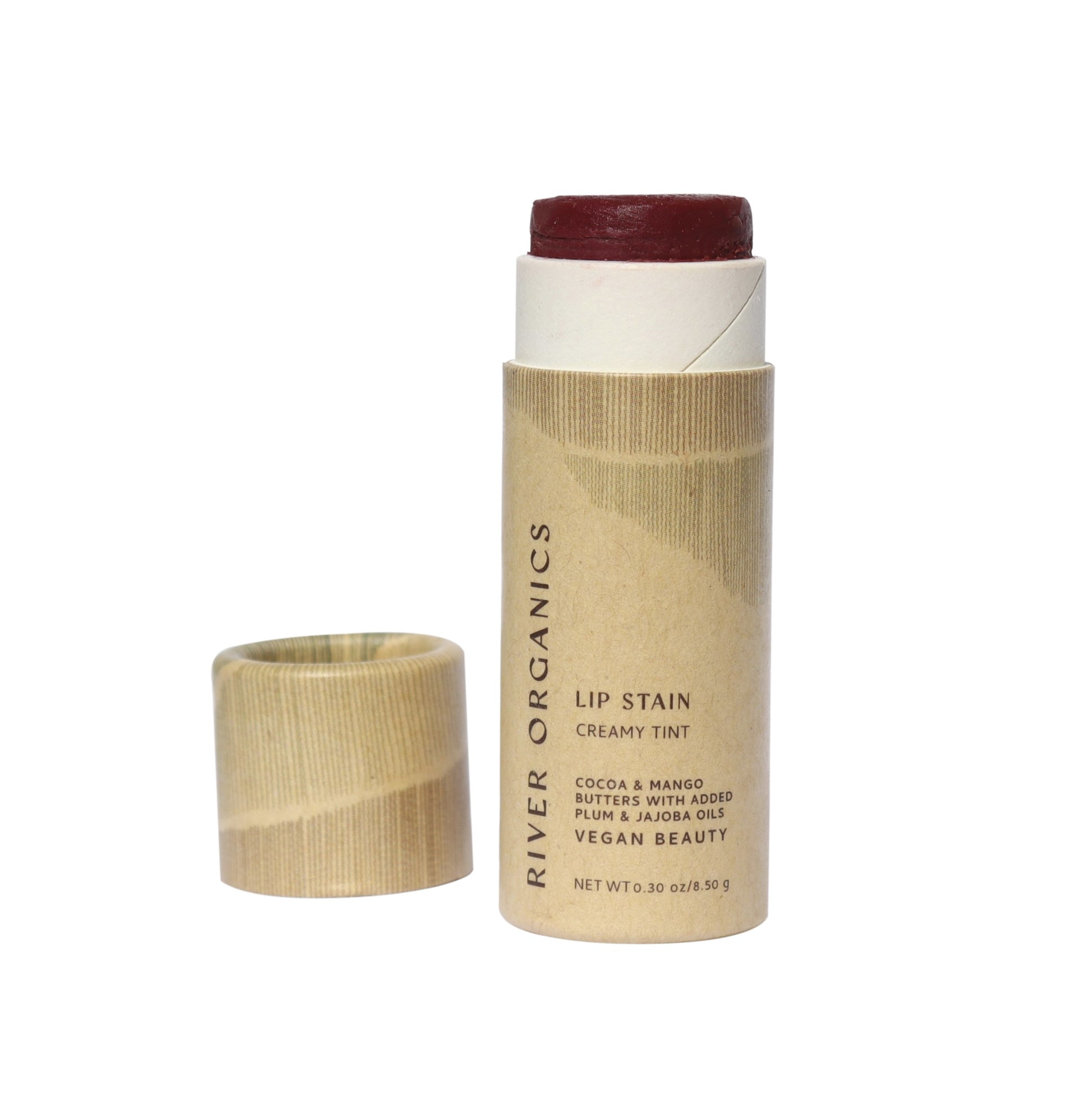 A River Organics Vegan Lip Stain in Fig, cap off, features creamy tint and hydrating cocoa and mango butters with plum and jojoba oils. The zero-waste package is eco-friendly.