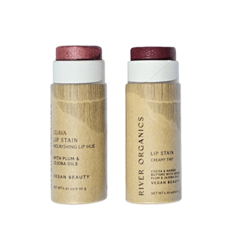 Introducing the Lip Stain Sets by River Organics: two tubes of plant-based, long-lasting lip stain in plum and reddish-brown shades. Each tube features a brown paper label displaying ingredients and vegan beauty branding, with white tops, all set against a white background.