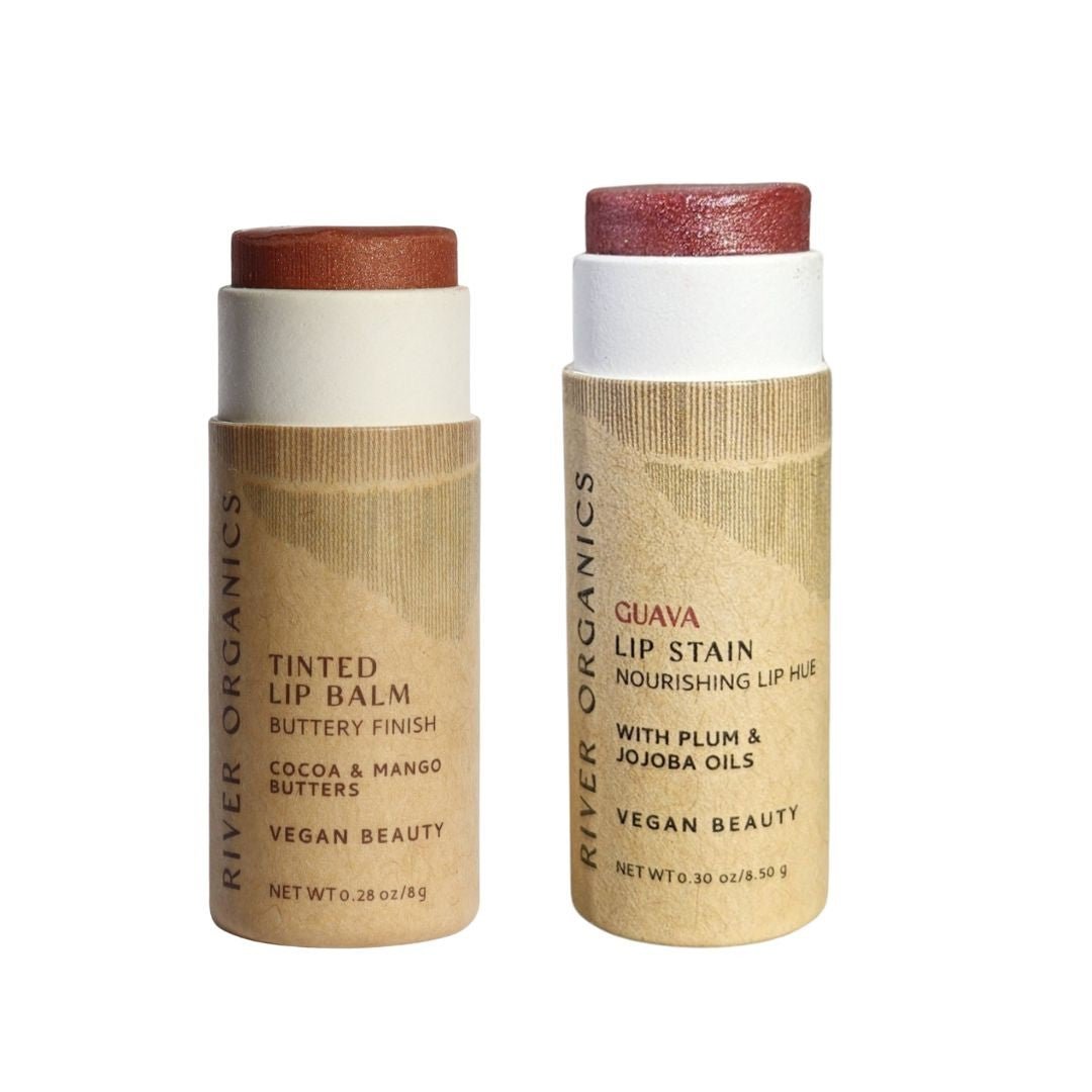 The image features River Organics' Set of 2 Lip Balms or Lip Stains in eco-friendly cardboard tubes, including a hydrating vegan tinted balm and a deeper-hued Guava Lip Stain. Both are organic, vegan, and sustainably packaged.