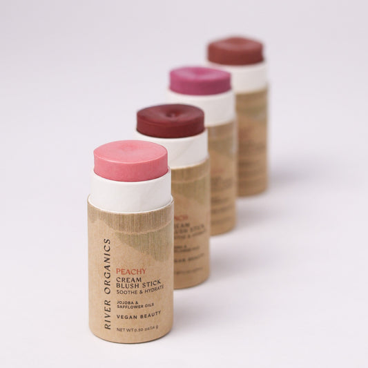 Four River Organics Natural Cream Blush Stick | All Colors in varying shades of pink and berry, arranged in a diagonal line.