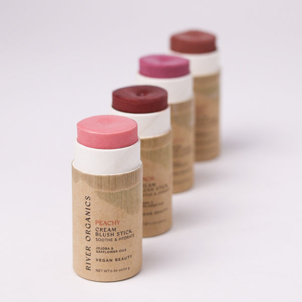 Four River Organics Natural Cream Blush Stick | All Colors in varying shades of pink and berry, arranged in a diagonal line.