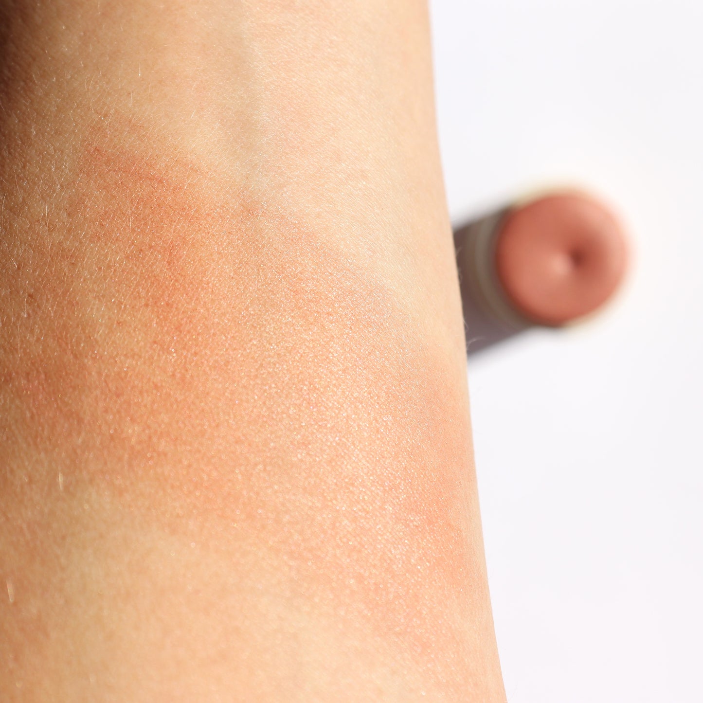 Swatch of Dusty Rose Creamy Vegan Blush Stick on arm