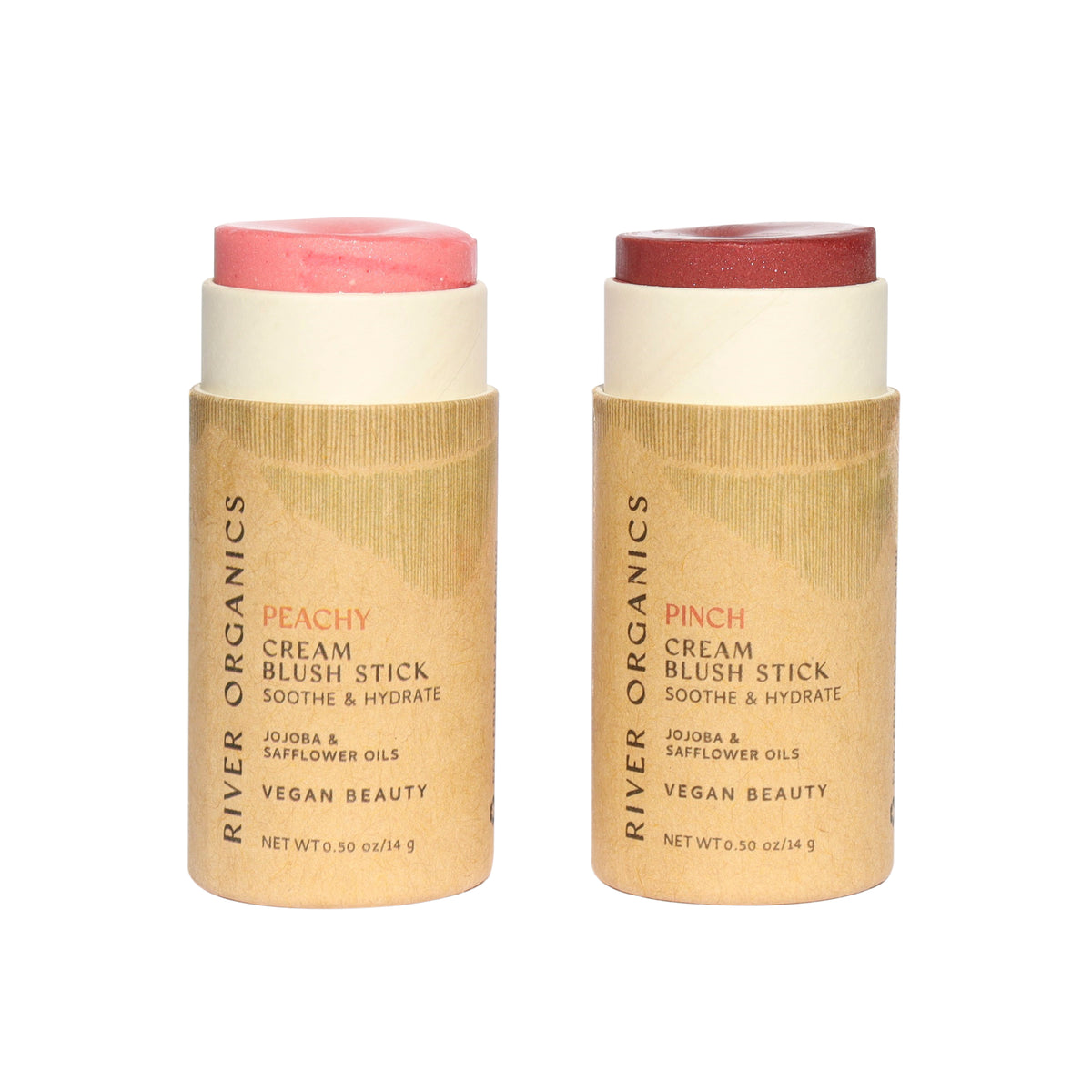 Two cardboard tubes branded “River Organics” showcase the Set of 2 | Natural Cream Blush Sticks—one in peach and one in deep rose. These zero-waste, vegan blush essentials feature hydrating jojoba and safflower oils, making them as gentle on your skin as they are on the planet.