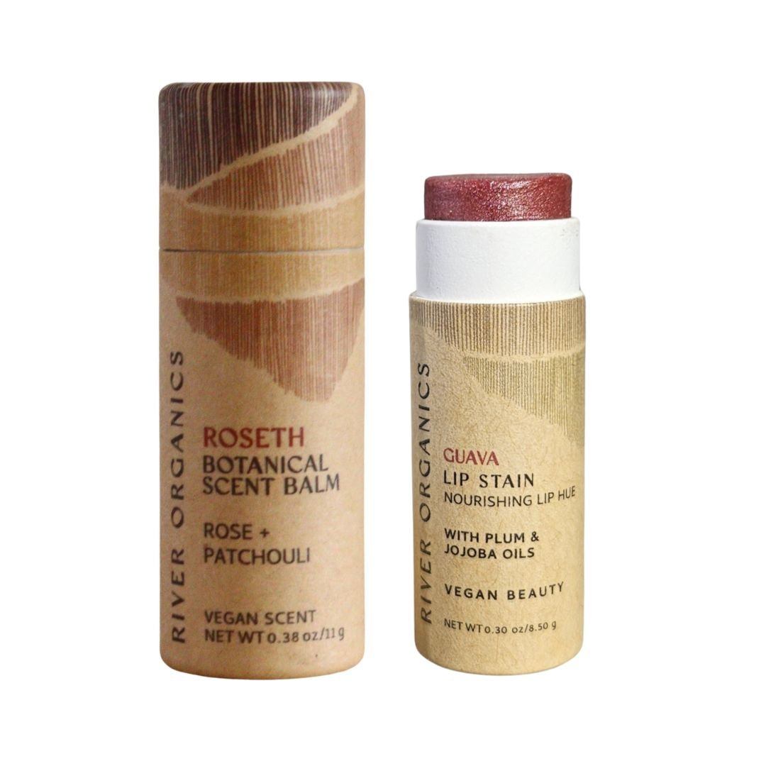 The River Organics Lip + Scent Balm Bundle features eco-friendly cylindrical tubes: a Roseth Scent Balm for your botanical ritual and a Guava Vegan Lip Balm with plum and jojoba oils.