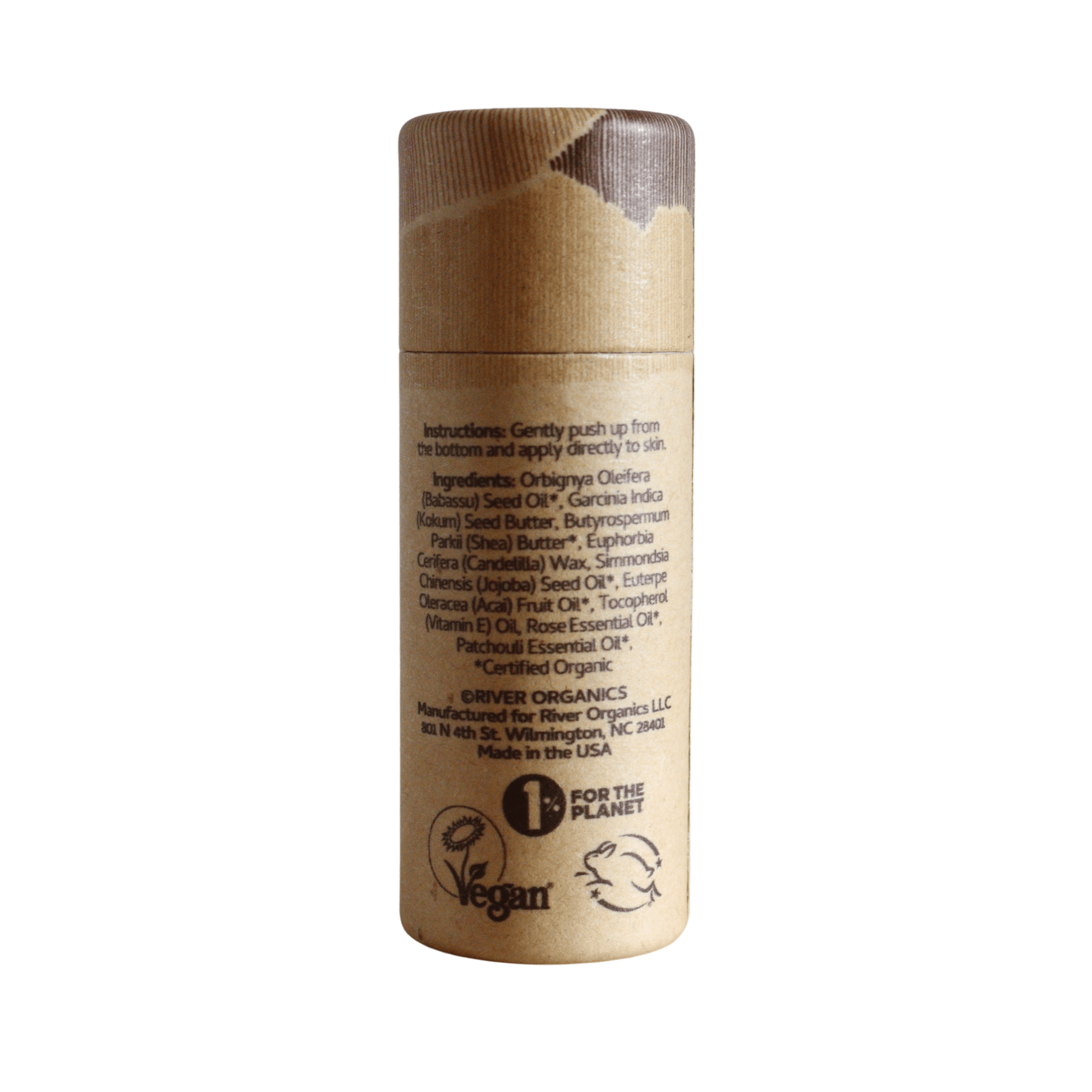 A cylindrical cardboard tube with a brown cap features instructions, ingredients, and the River Organics Roseth: Rose + Patchouli Botanical Scent Balm. Vegan, cruelty-free, and "1% for the Planet" symbols are visible at the bottom.