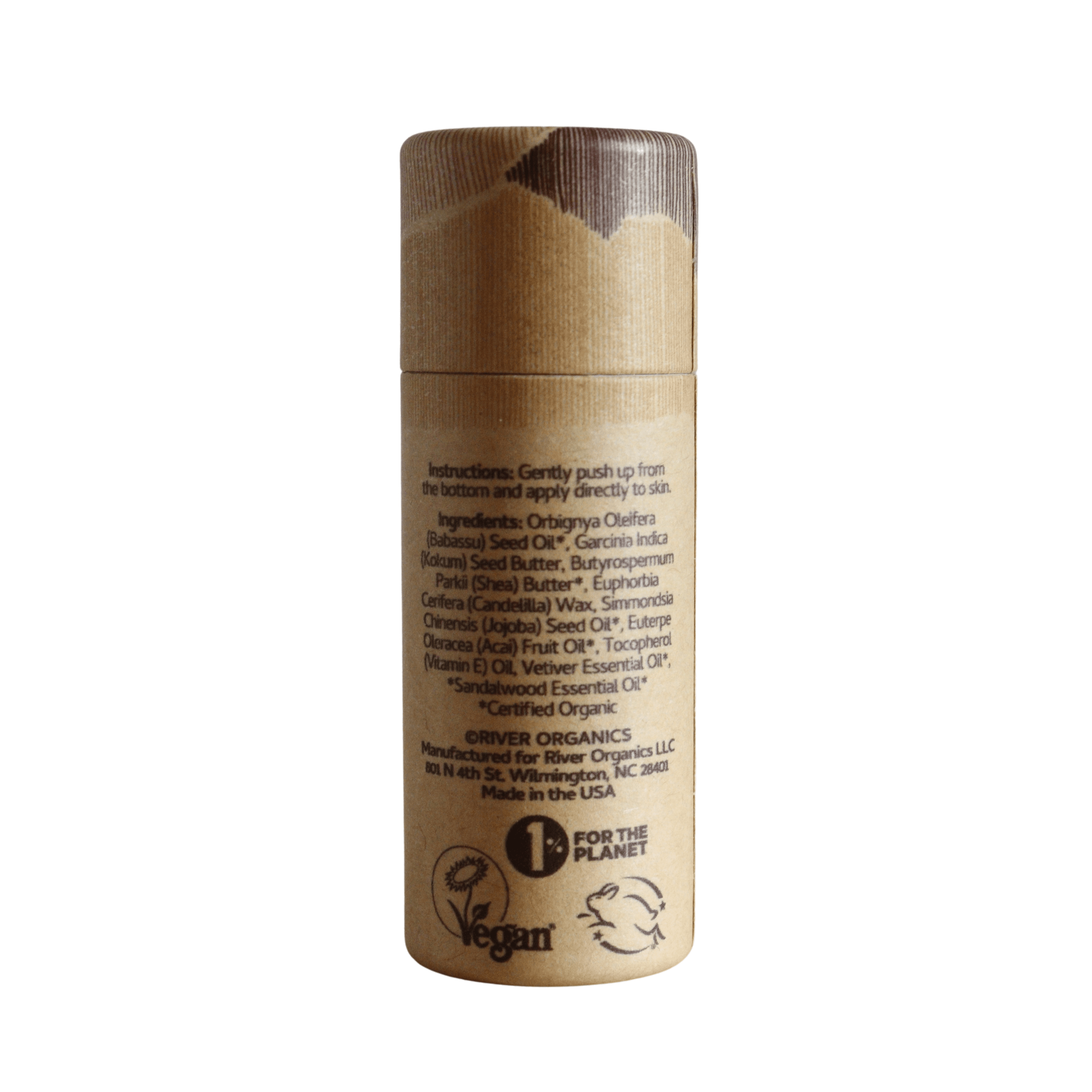 River Organics' Still Earth: Vetiver + Sandalwood Botanical Scent Balm comes in a cylindrical cardboard tube with brown vegan packaging, highlighting a soothing, earthy aroma of vetiver and sandalwood.