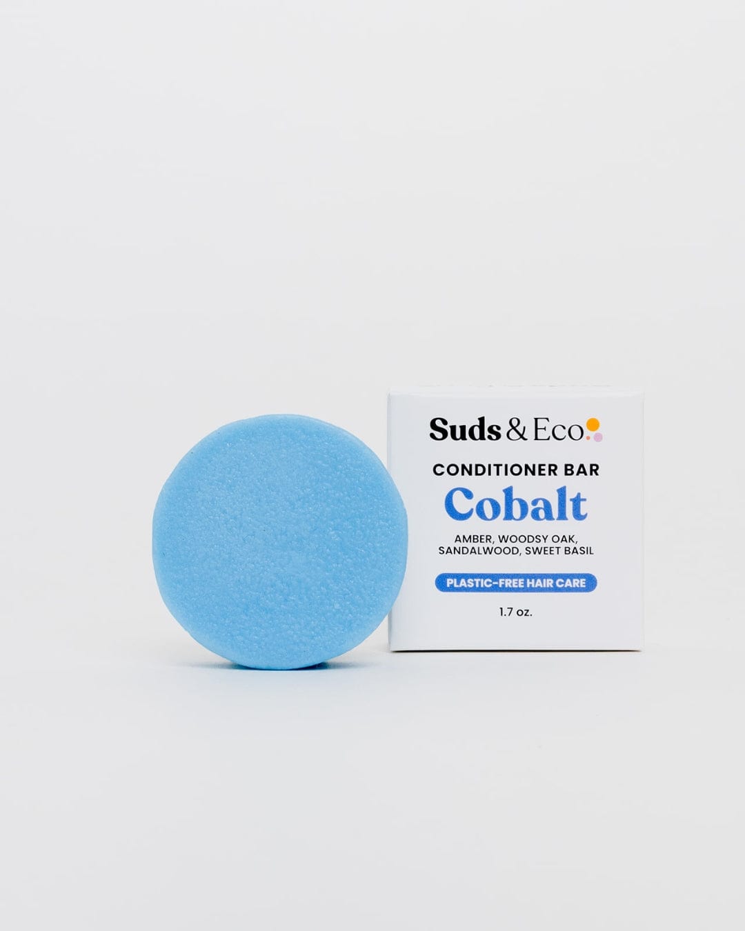 A blue circle with a white box beside it, symbolizing the ZeroWasteStore.com Conditioner Bar—a vegan choice for a zero waste hair care routine.