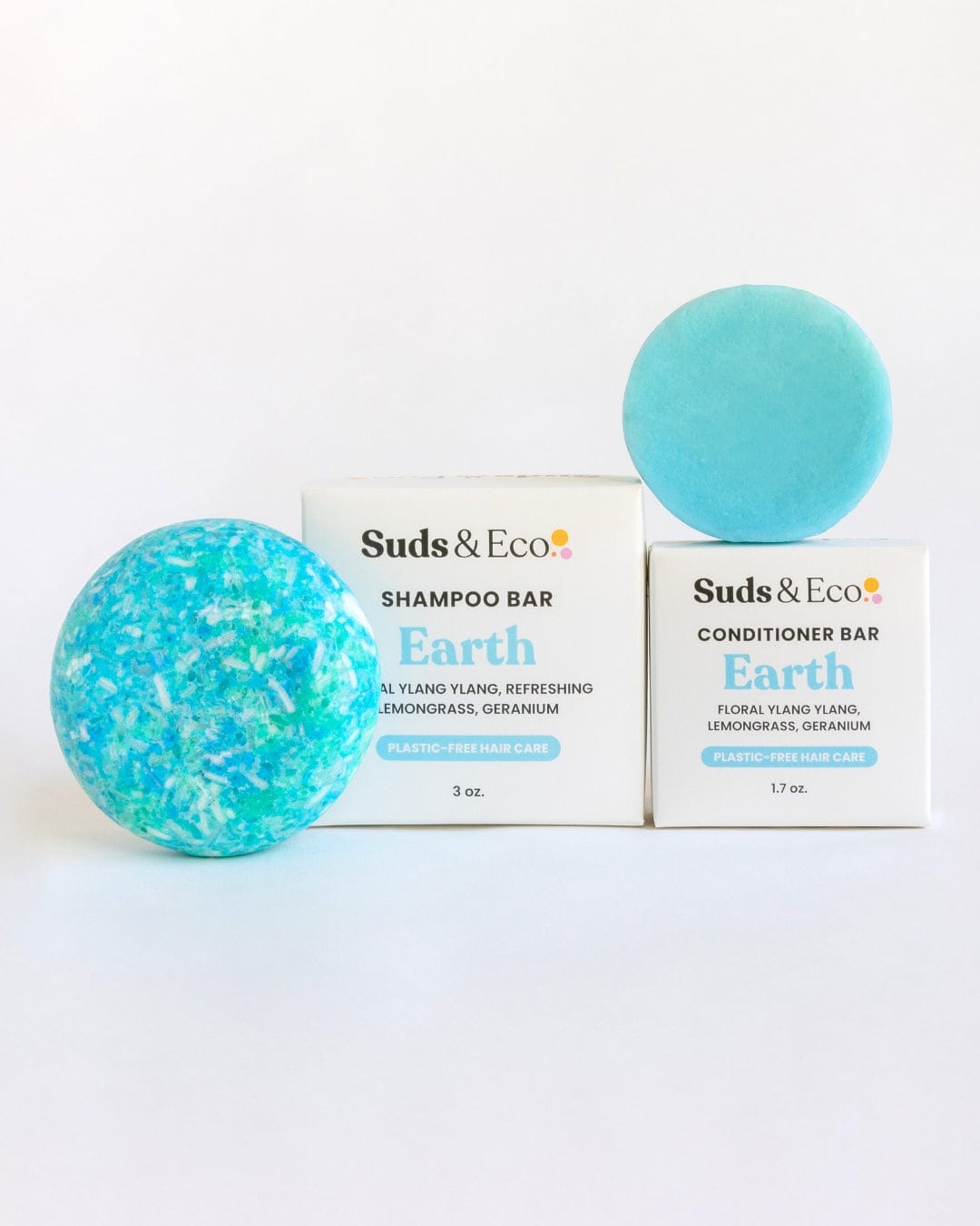 Two blue round "Shampoo & Conditioner Bar Duo" bars by ZeroWasteStore.com are shown in front of white boxes with black text, displayed on a plain white background for a zero waste haircare routine.