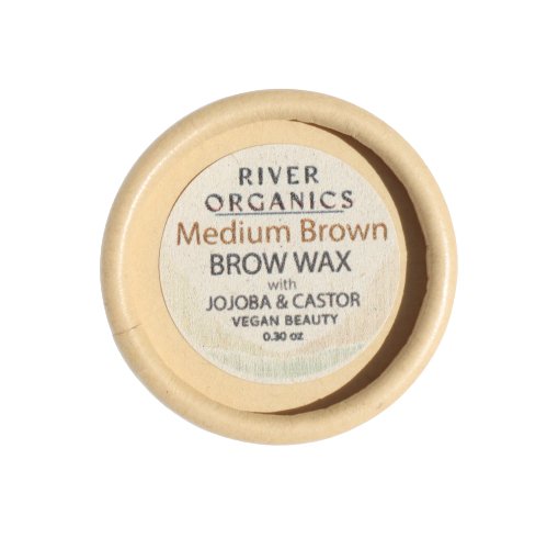 A round container of River Organics Skincare Tinted Vegan Eyebrow Wax | Medium Brown. The label includes "with Jojoba & Castor," "Vegan Beauty," and "0.30 oz." This cruelty-free certified, vegan brow color comes in a light beige container with a simple, eco-friendly design.